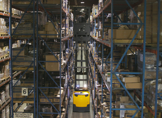 jungheinrich order picker up high in narrow aisle